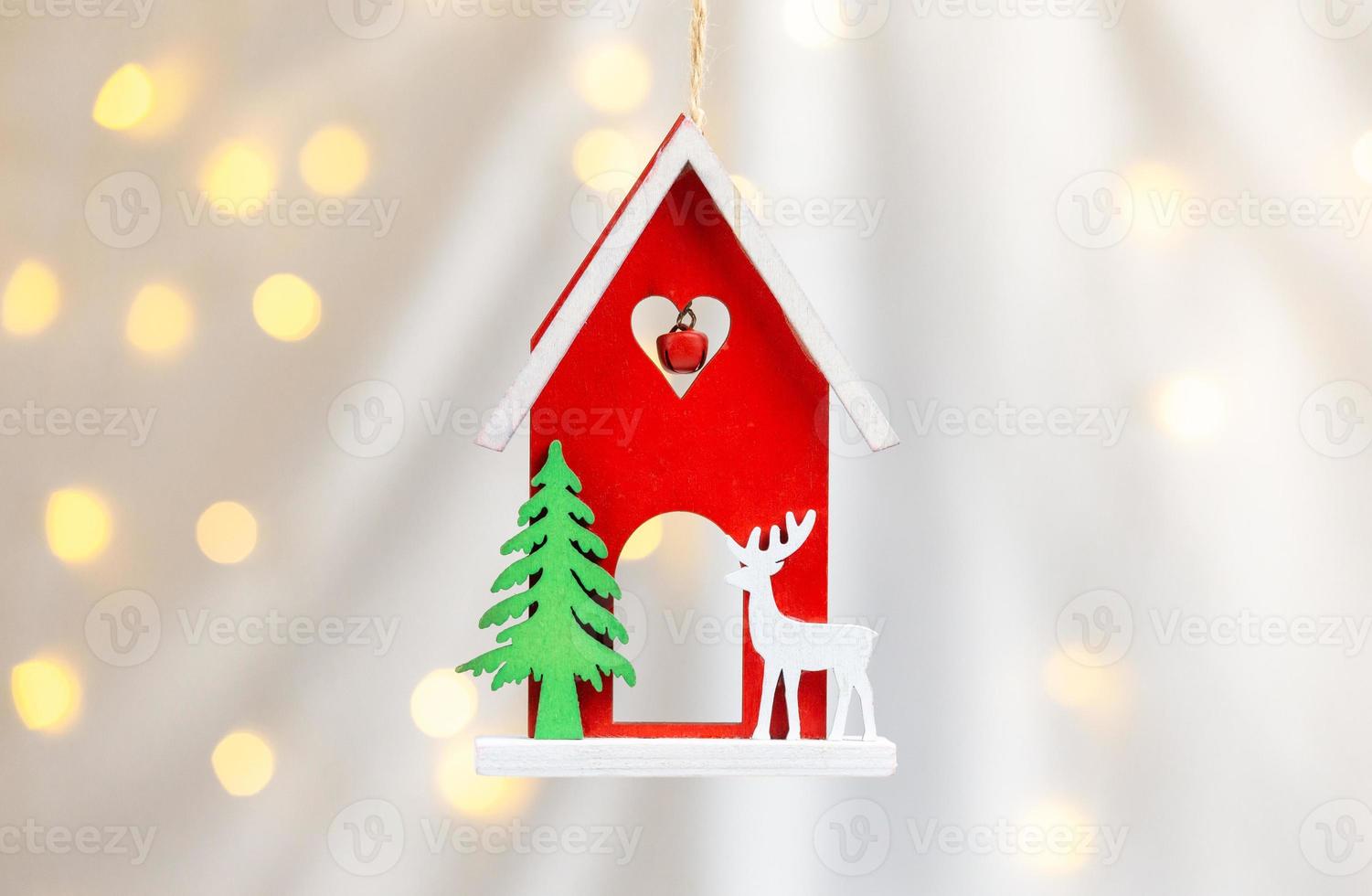 Wooden Xmas toy house with deer photo