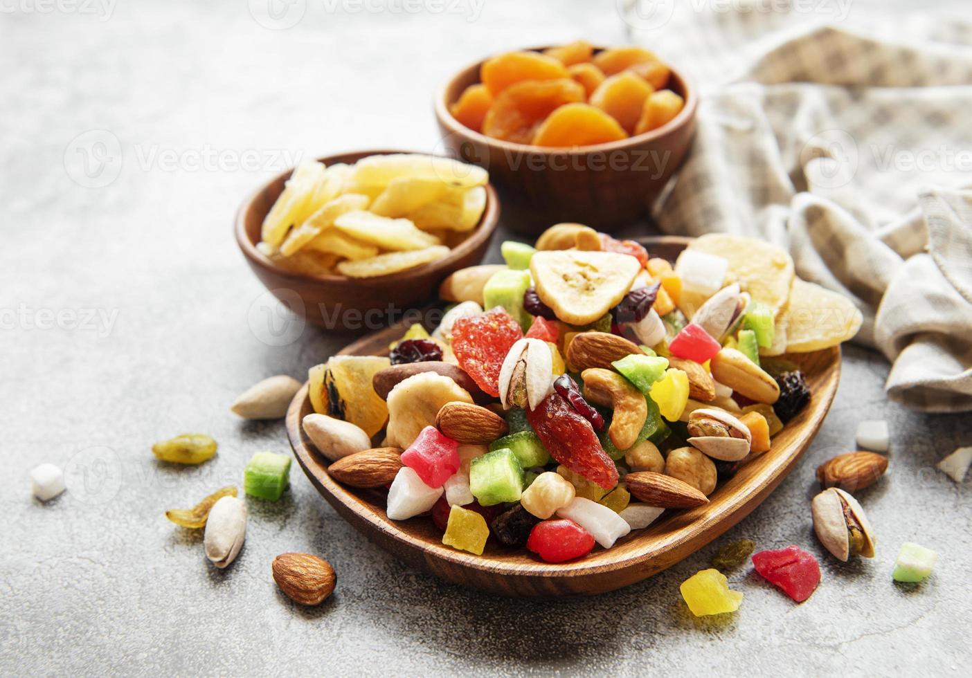 Bowls with various dried fruits and nuts photo