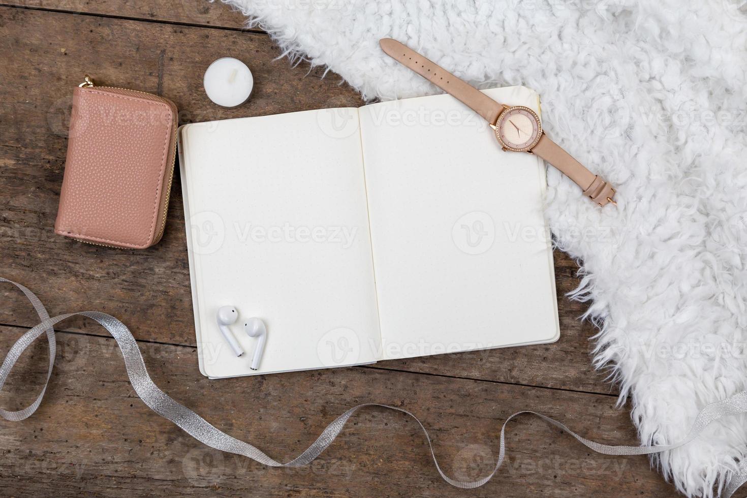 Top view of accessories on wooden background photo