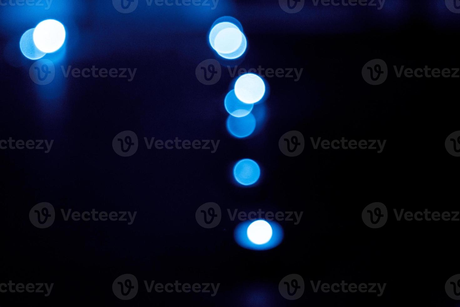 Blue bokeh background created by neon lights photo