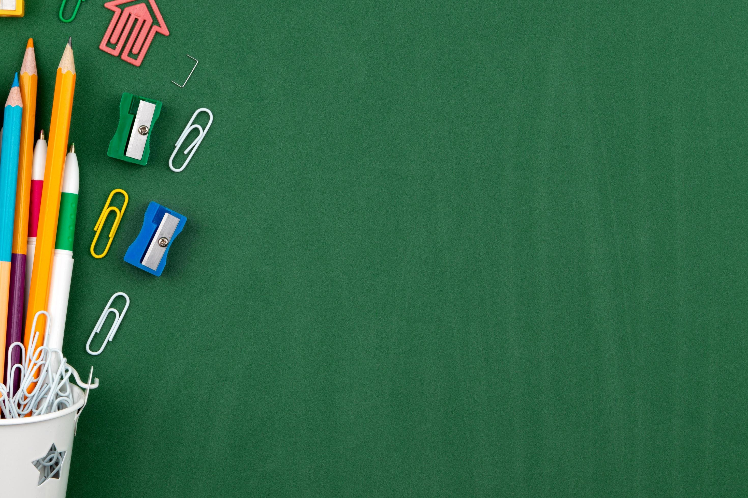 Still life on green school board background 2437811 Stock Photo at Vecteezy