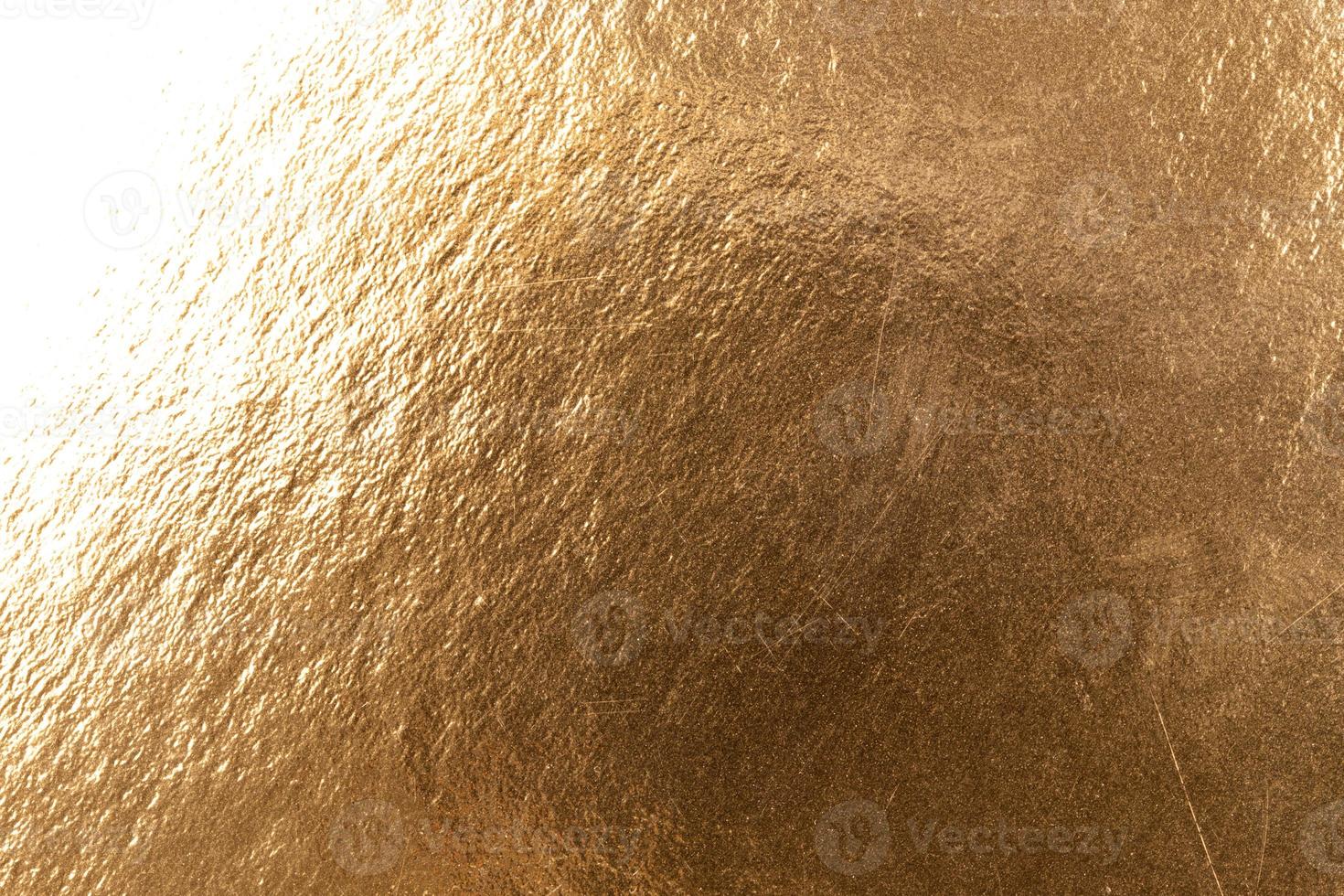 Abstract texture of golden metal macro shot background at close range photo