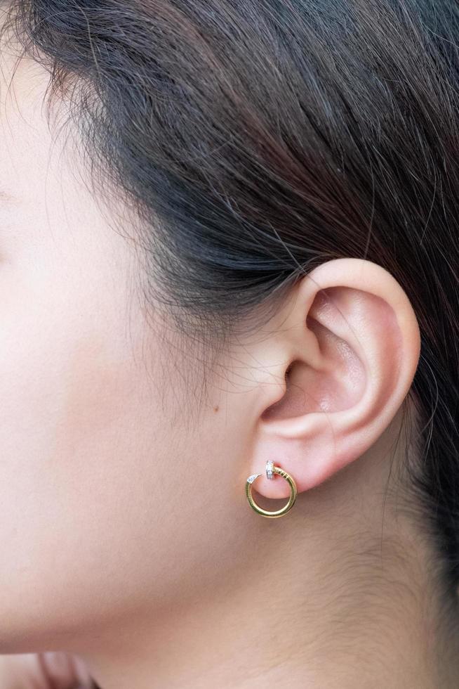 Asian woman with diamond earring photo