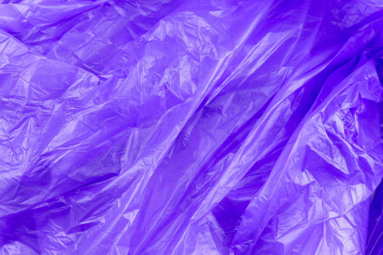 Textura abstracta de bolsa de basura de celofán púrpura foto