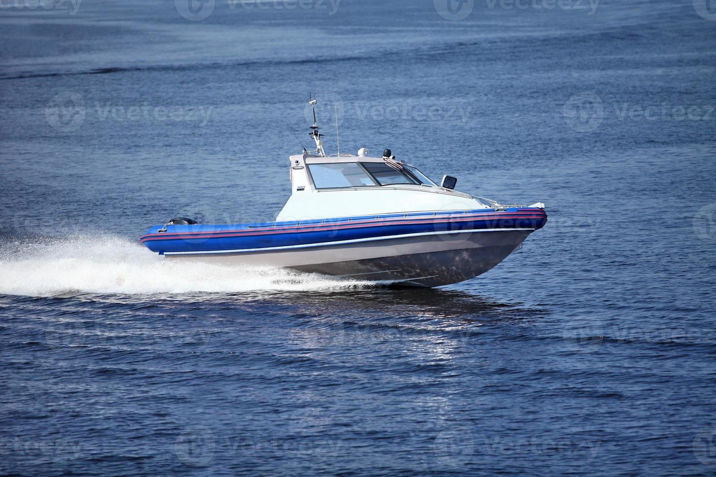 Speedboat cruising in the sea photo