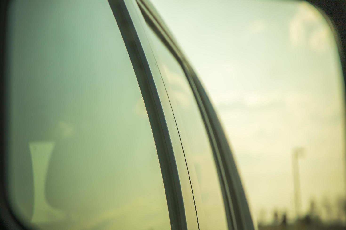 Sky reflected on the windows of a car photo