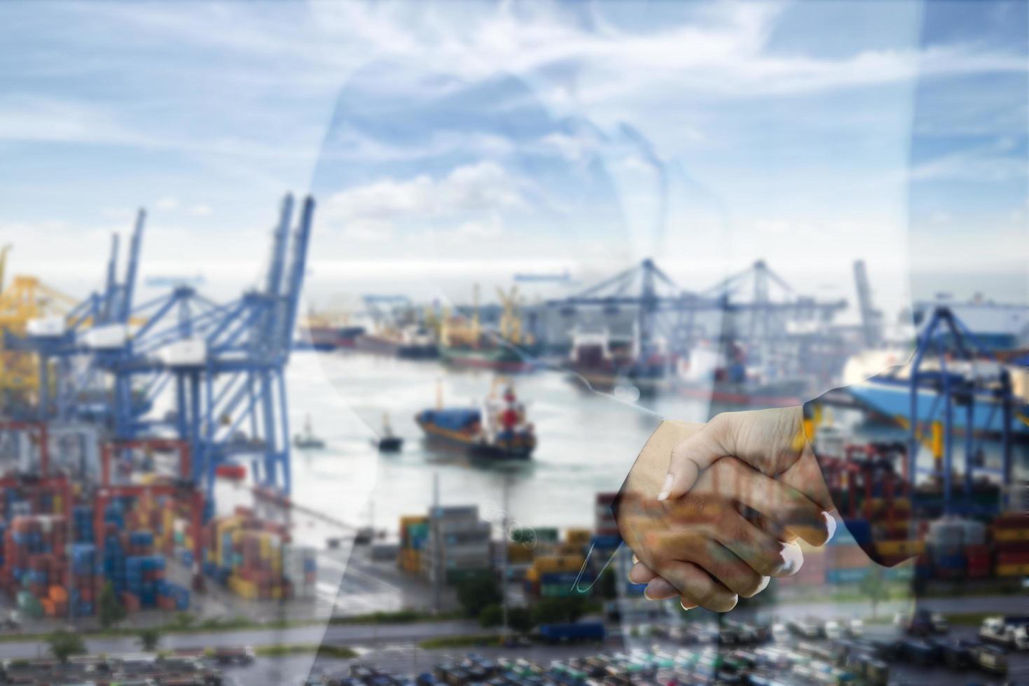 Container cargo freight ship with working crane bridge photo