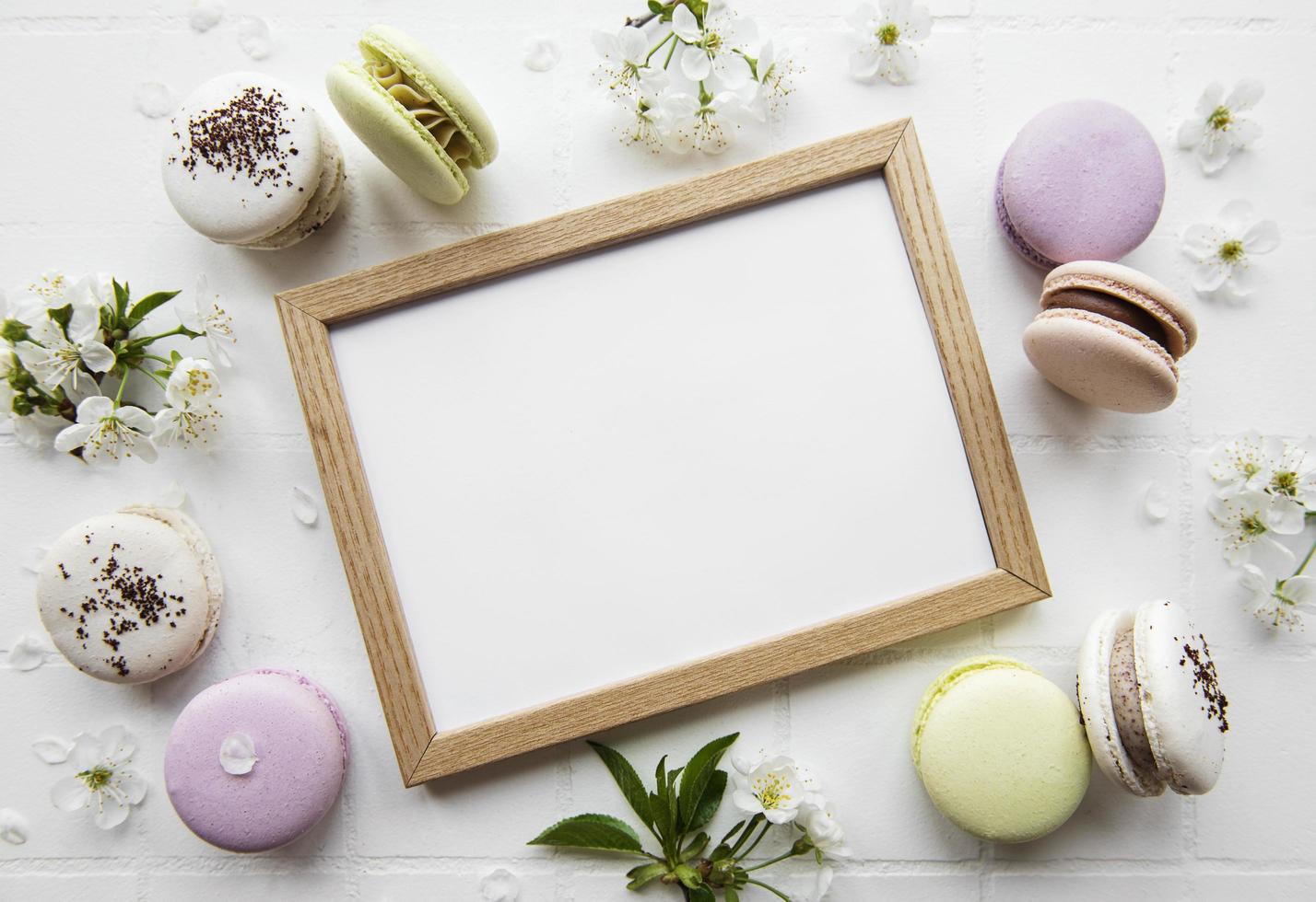 Wooden frame mockup with  macaroons  and spring blossom photo