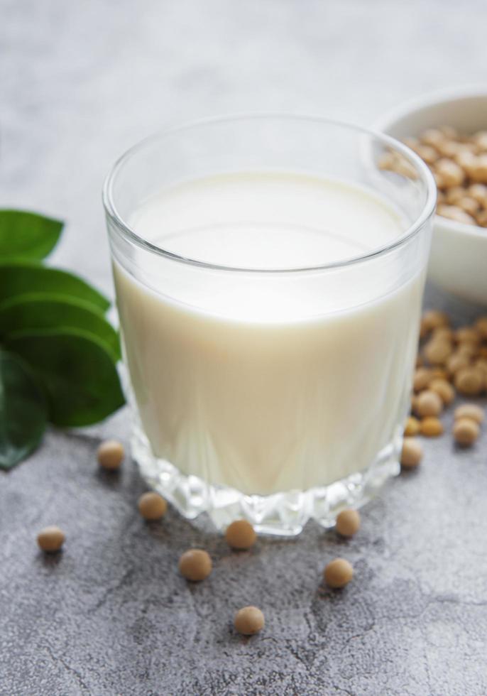 Soy milk and soy on the table photo