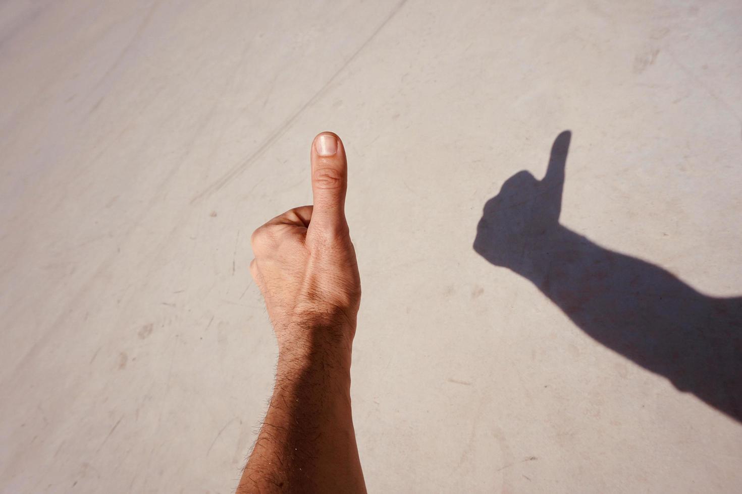 hand gesturing in the shadows photo