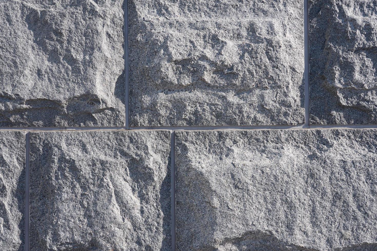 la pared de bloques de granito es como un fondo foto