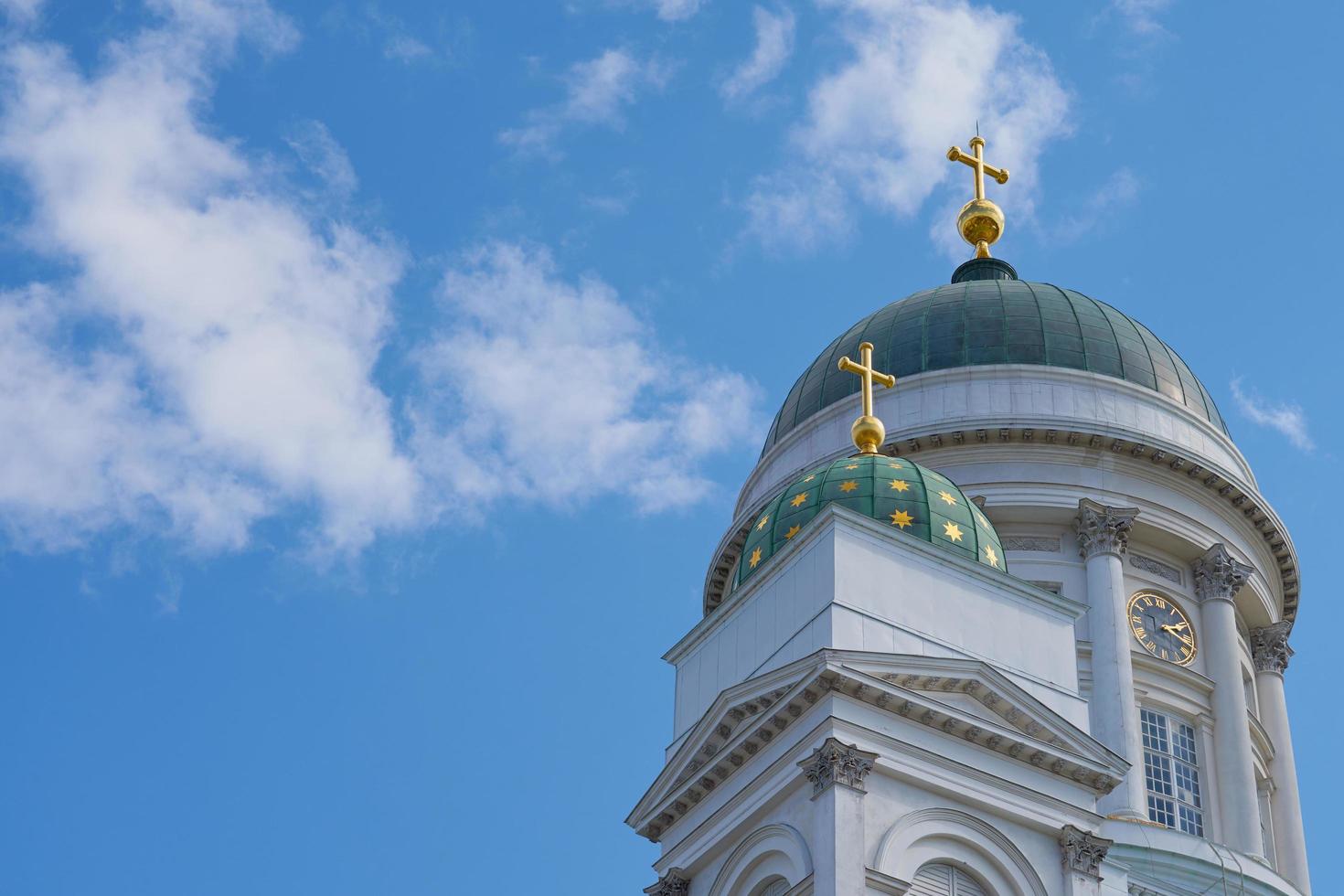 The towers of the cathedral in Helsinki against the blue sky photo