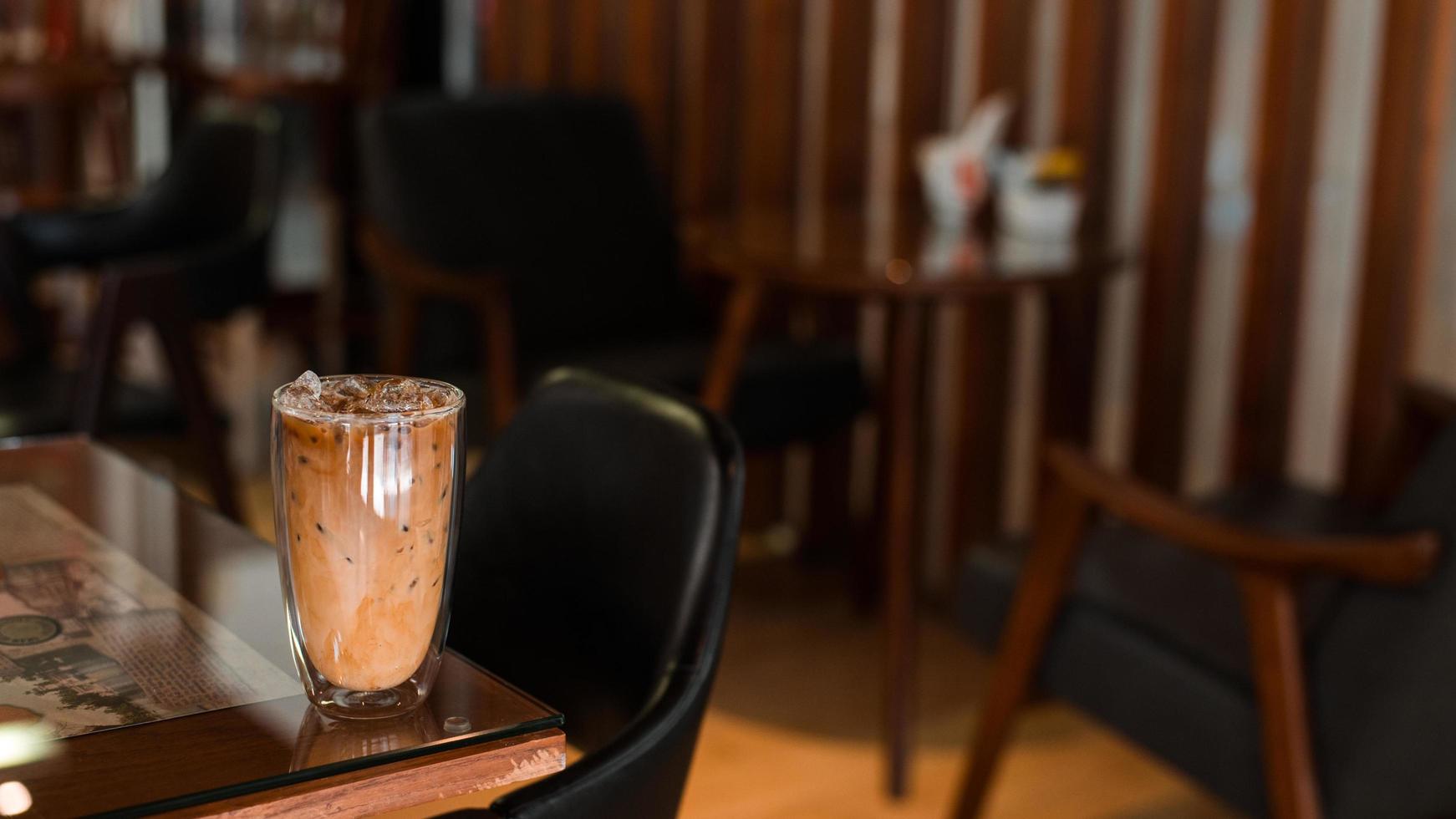 Iced coffee on the table inside the cafe photo