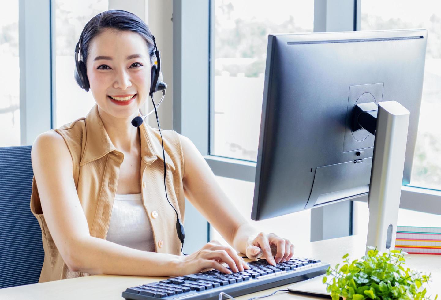 Young businesswoman working with a laptop at home photo