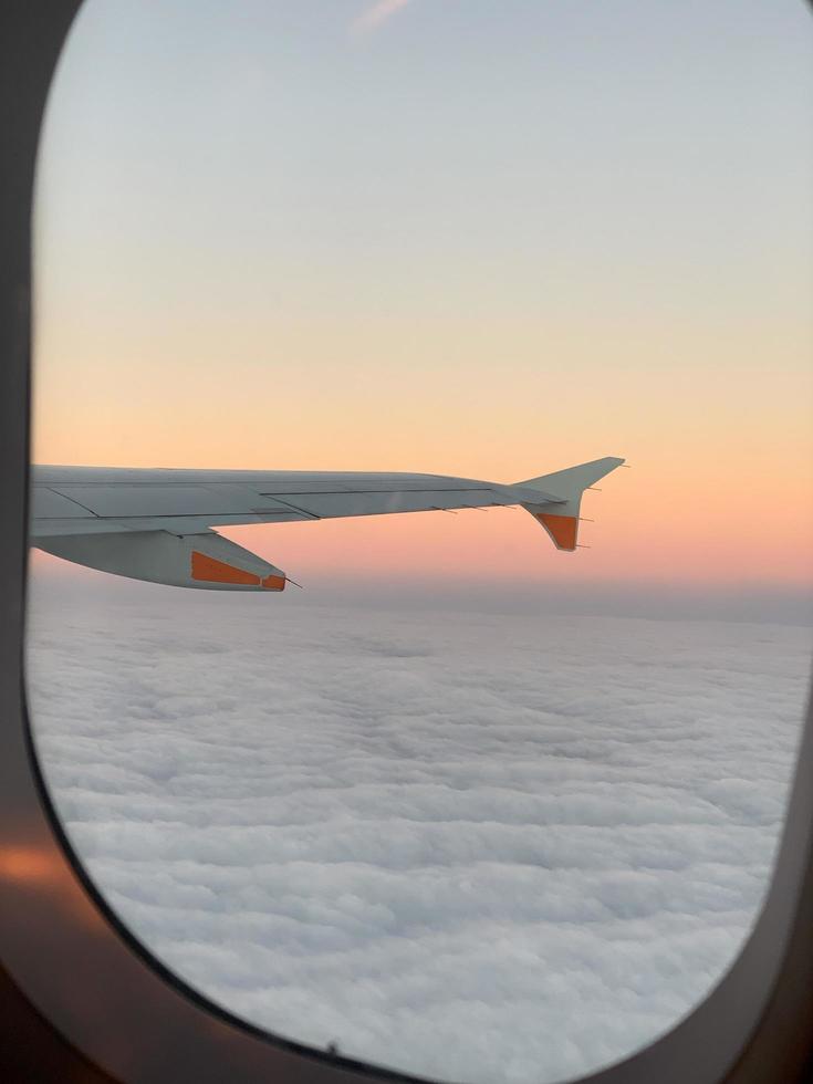 Airplane wing at sunset photo