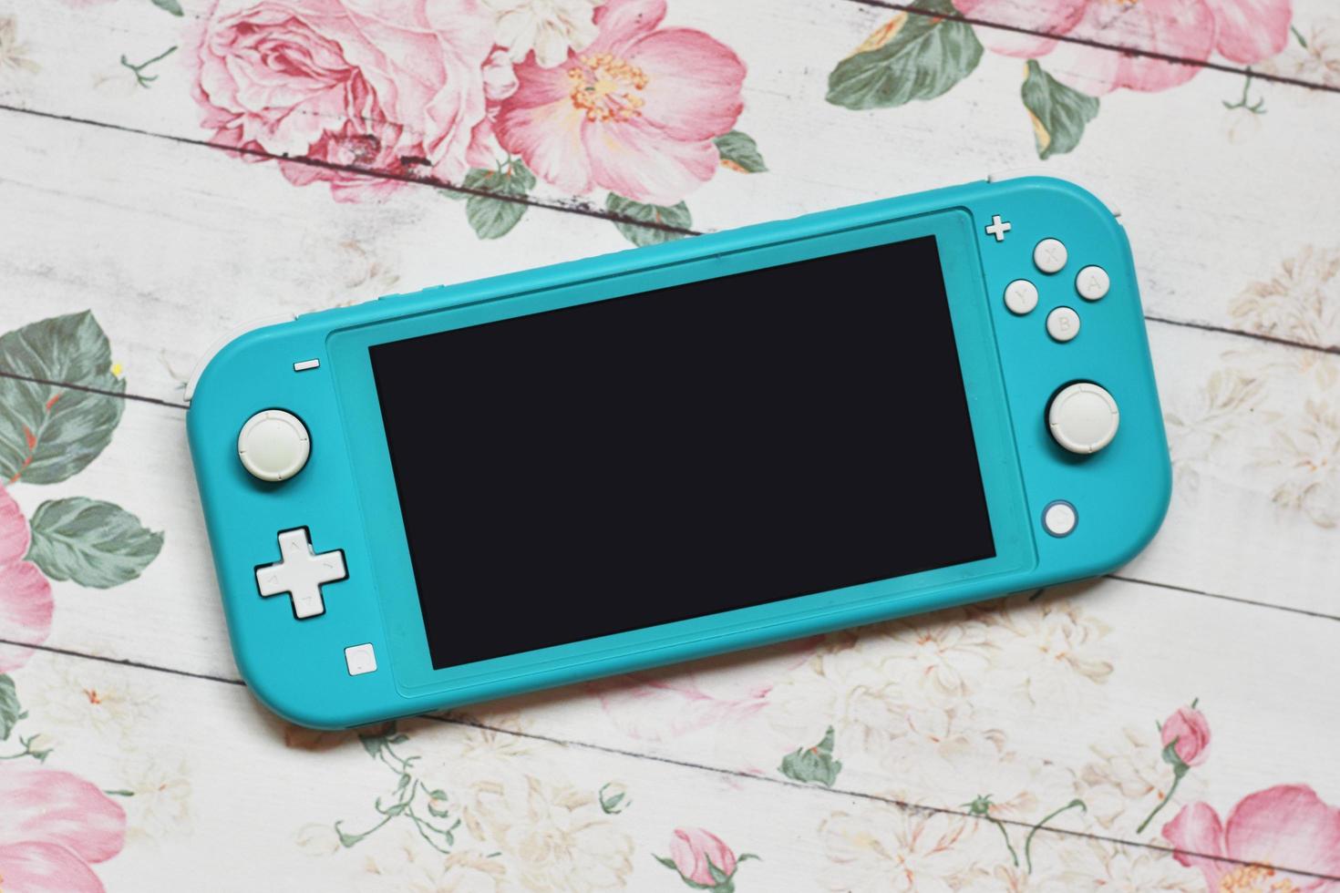 Switch lite on spring flower background photo