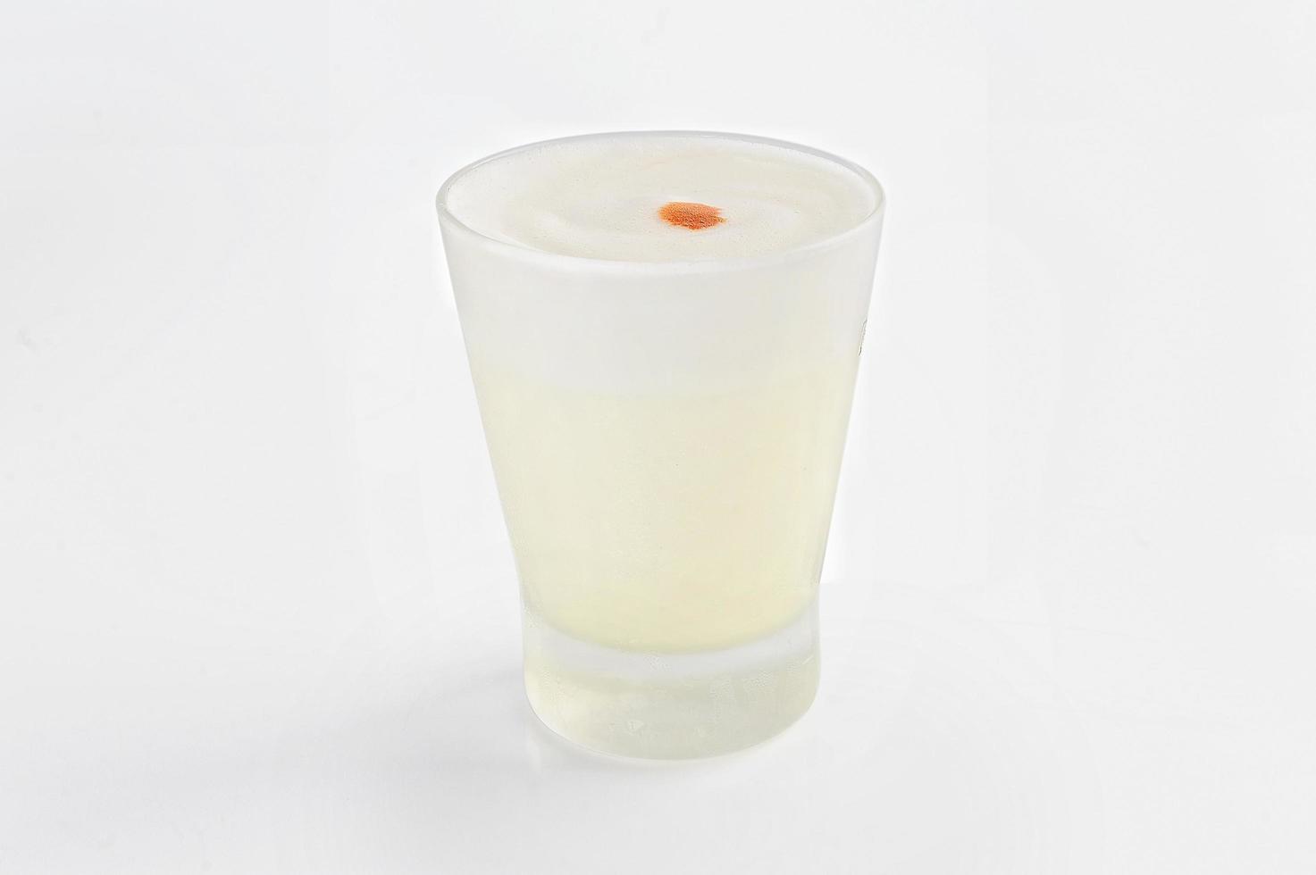 Pisco sour a typical Peruvian drink based on Pisco and lemon photo