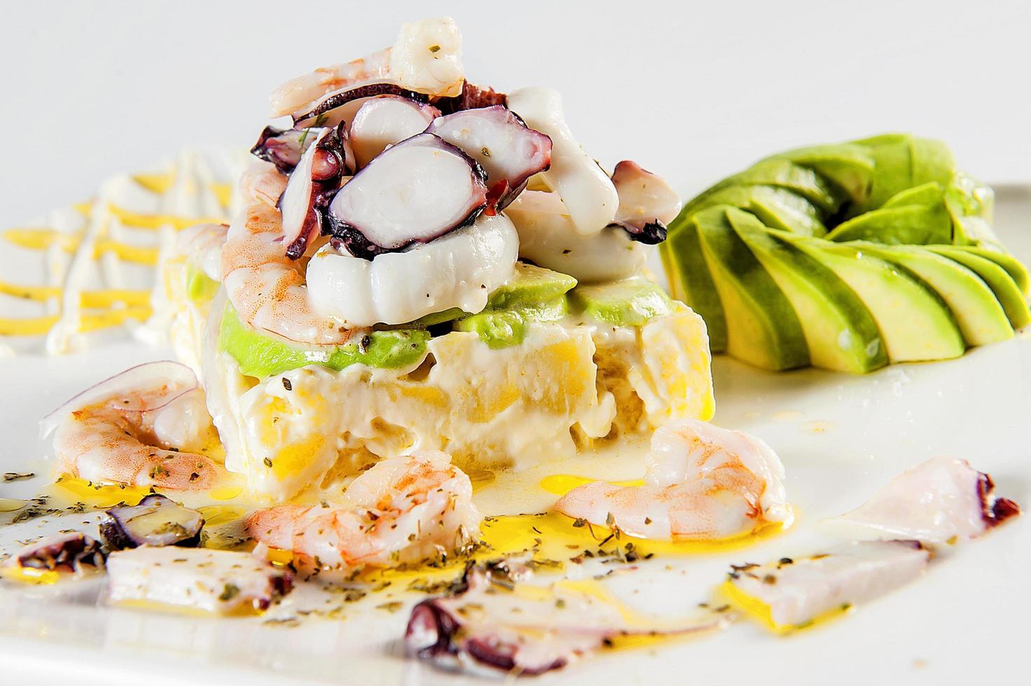 Causa stuffed with seafood traditional dish of Peruvian cuisine photo