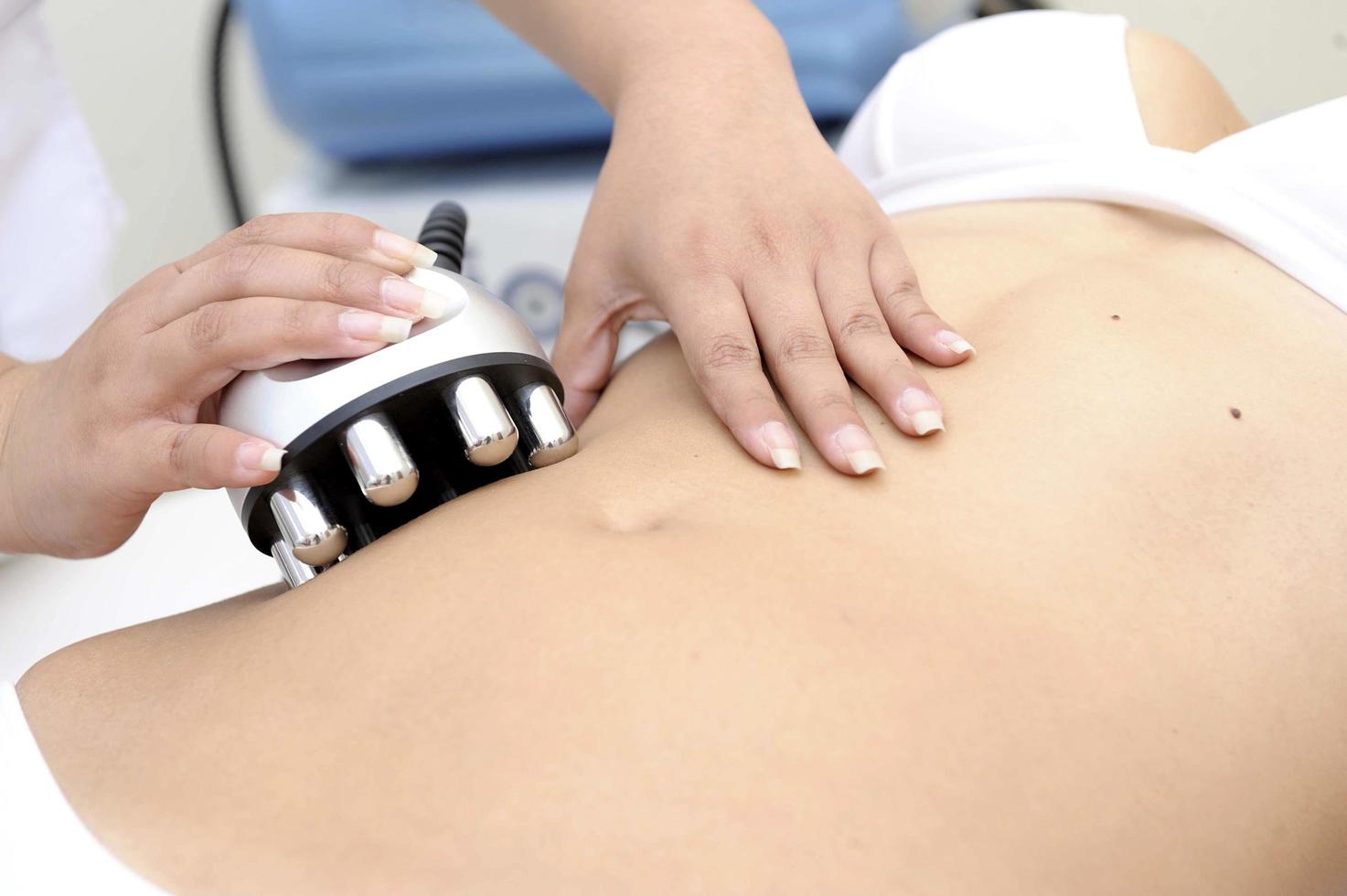 Cosmetology Closeup Of Beautician Doing Laser Epilation Treatment photo