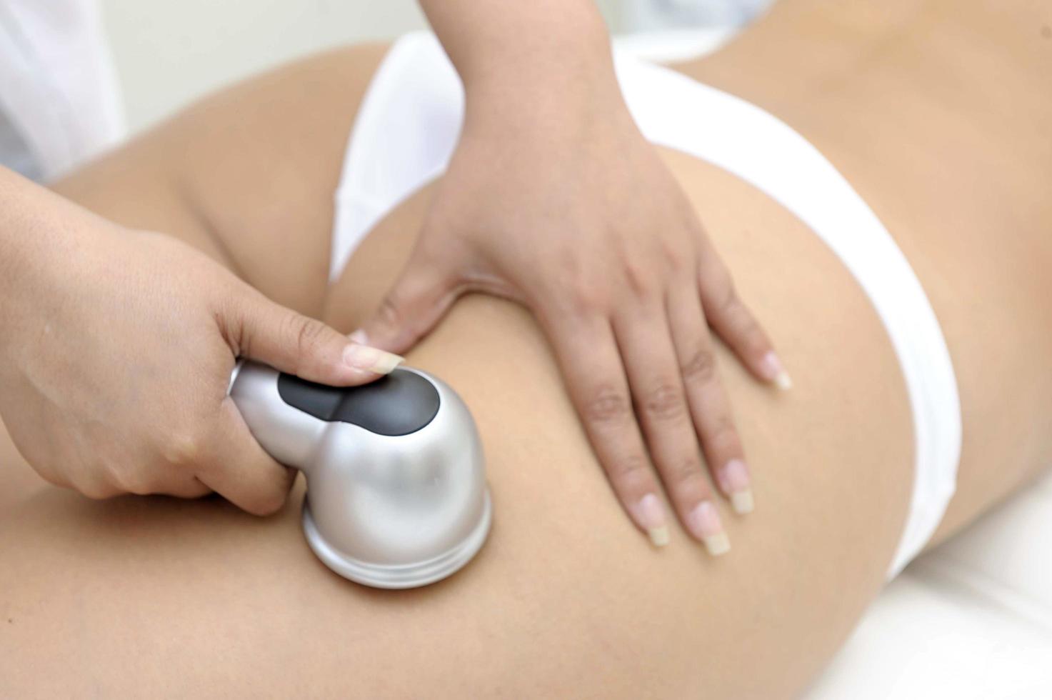 Cosmetology Closeup Of Beautician Doing Laser Epilation Treatment photo