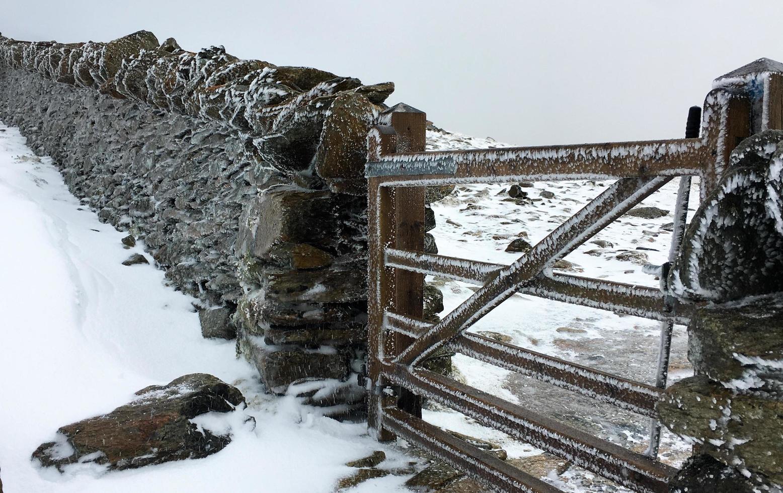Frozen pathway through the gates in Snowdonia photo