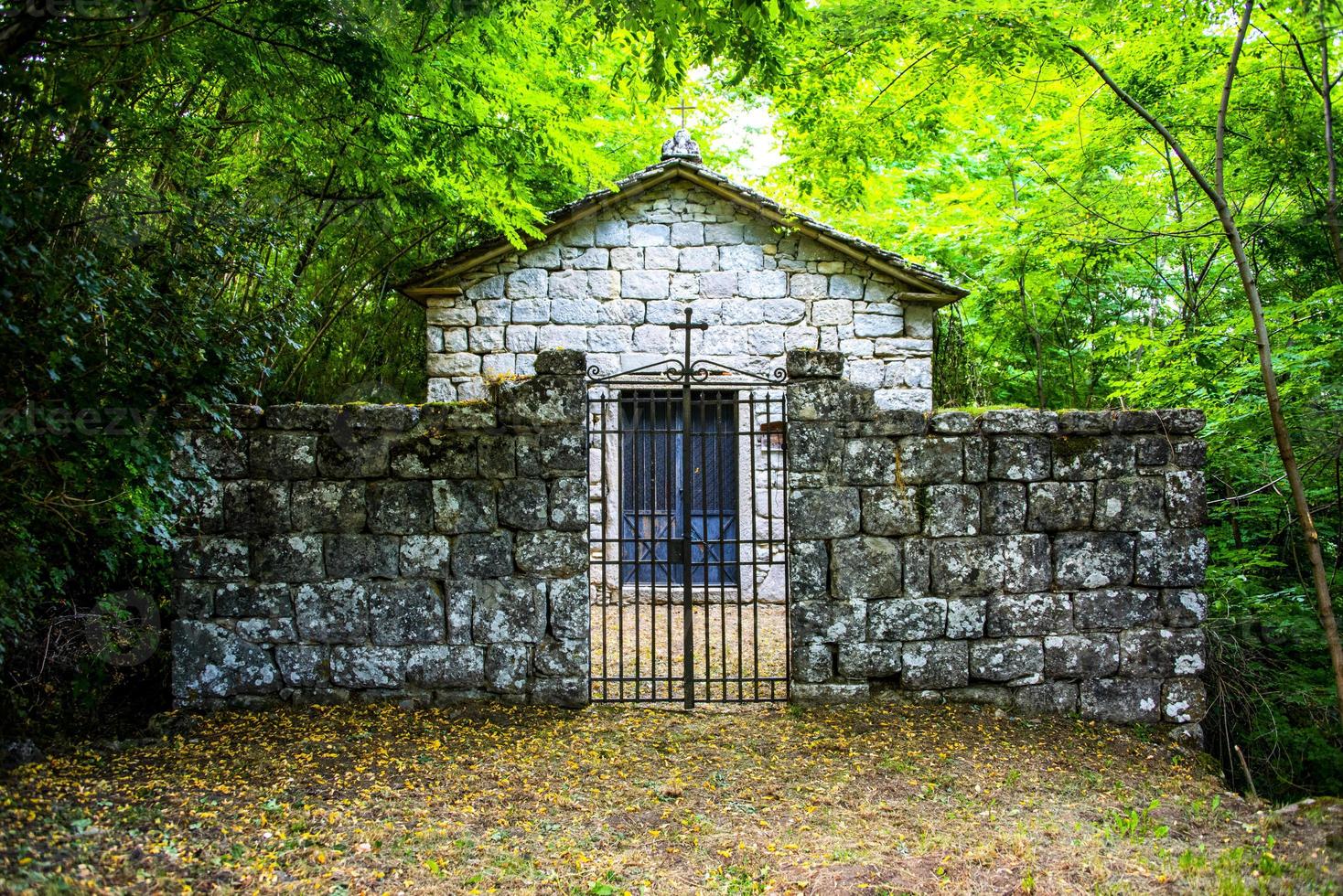 Old chapel in the middle of the woods of Chiusi Della Verna, Arezzo, Tuscany, Italy photo