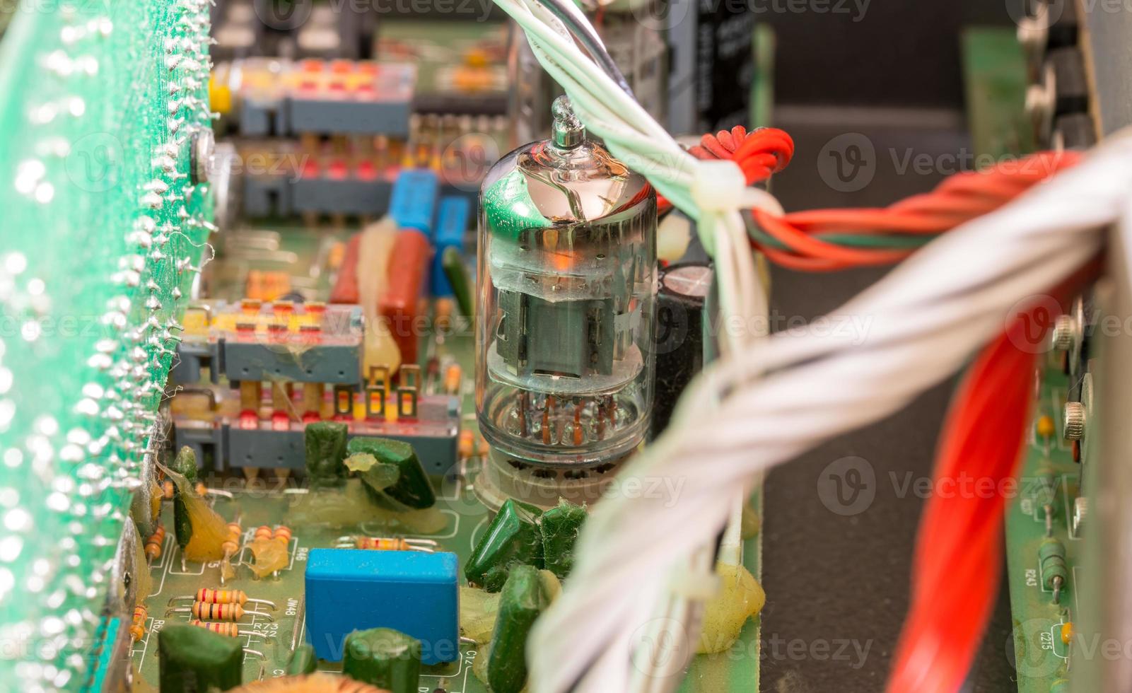 Electrical assembly with tube on a circuit board with electrical components and cables photo
