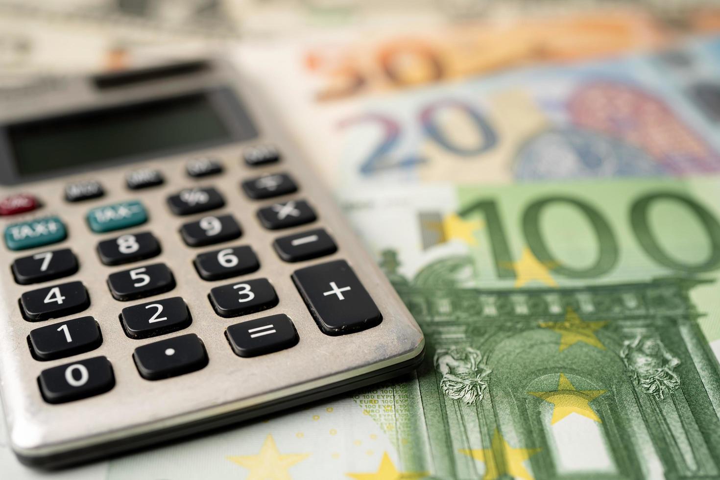 Calculator on Euro banknotes background photo