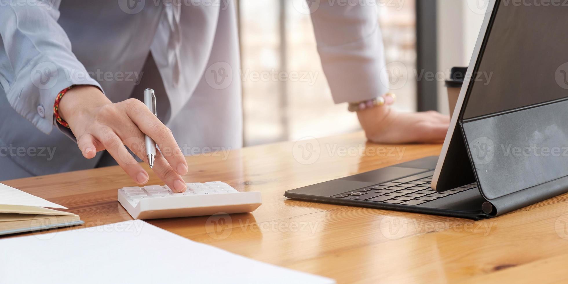 Close up of businesswoman accountant or banker making calculations Business Financing Accounting Banking Concept photo