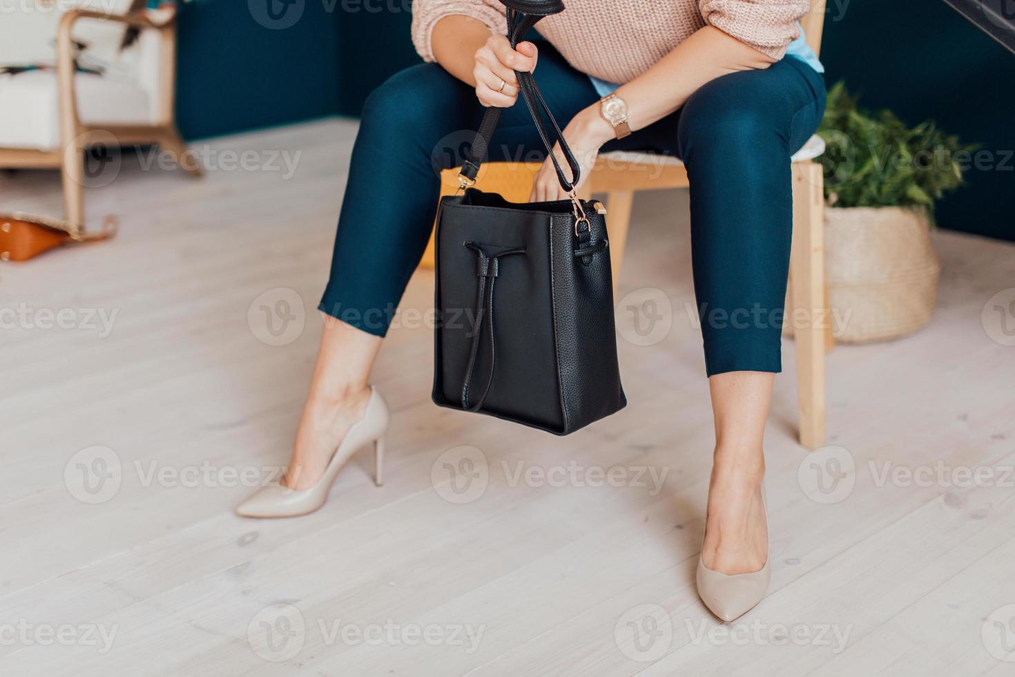 Beautiful bags compliment the style of a beautifully dressed girl photo