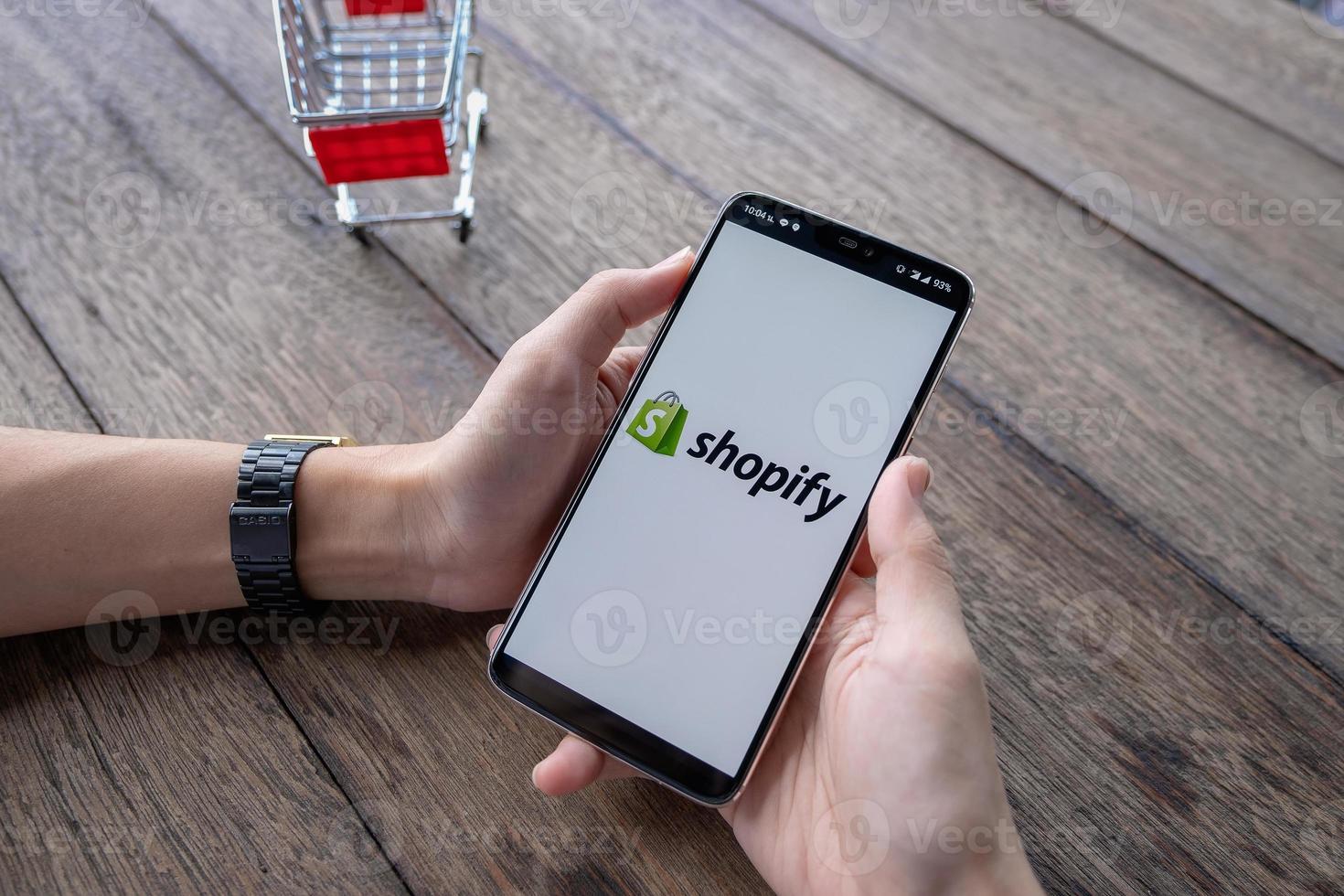 CHIANG MAI, THAILAND, May 11 2019, Man hand holding Oneplus 6 with login screen of Shopify application photo