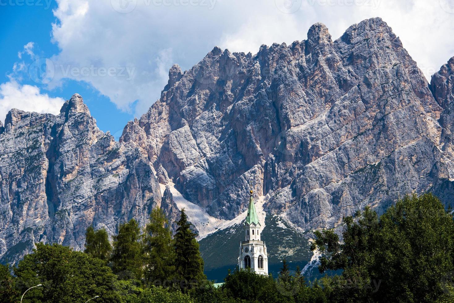 Bell tower and Dolomite peaks photo