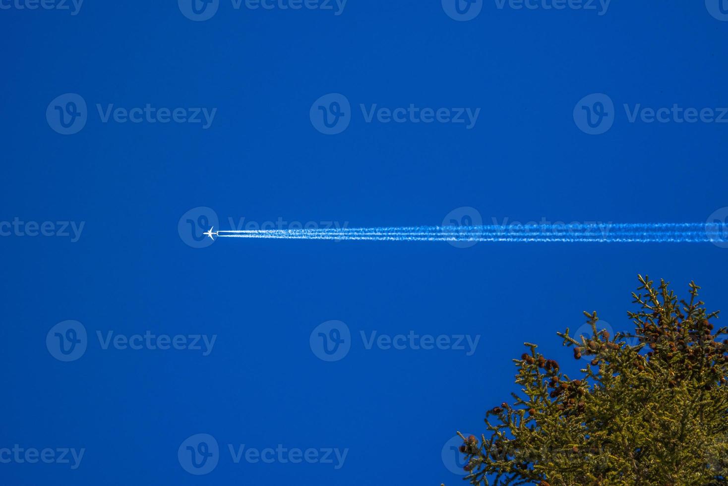 Airplane on blue sky photo