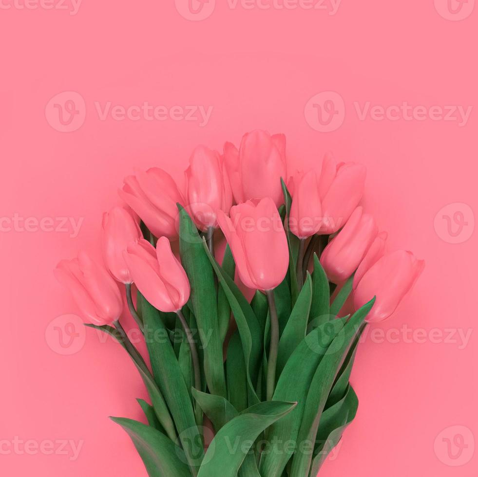 ramo de tulipanes sobre fondo rosa suave foto