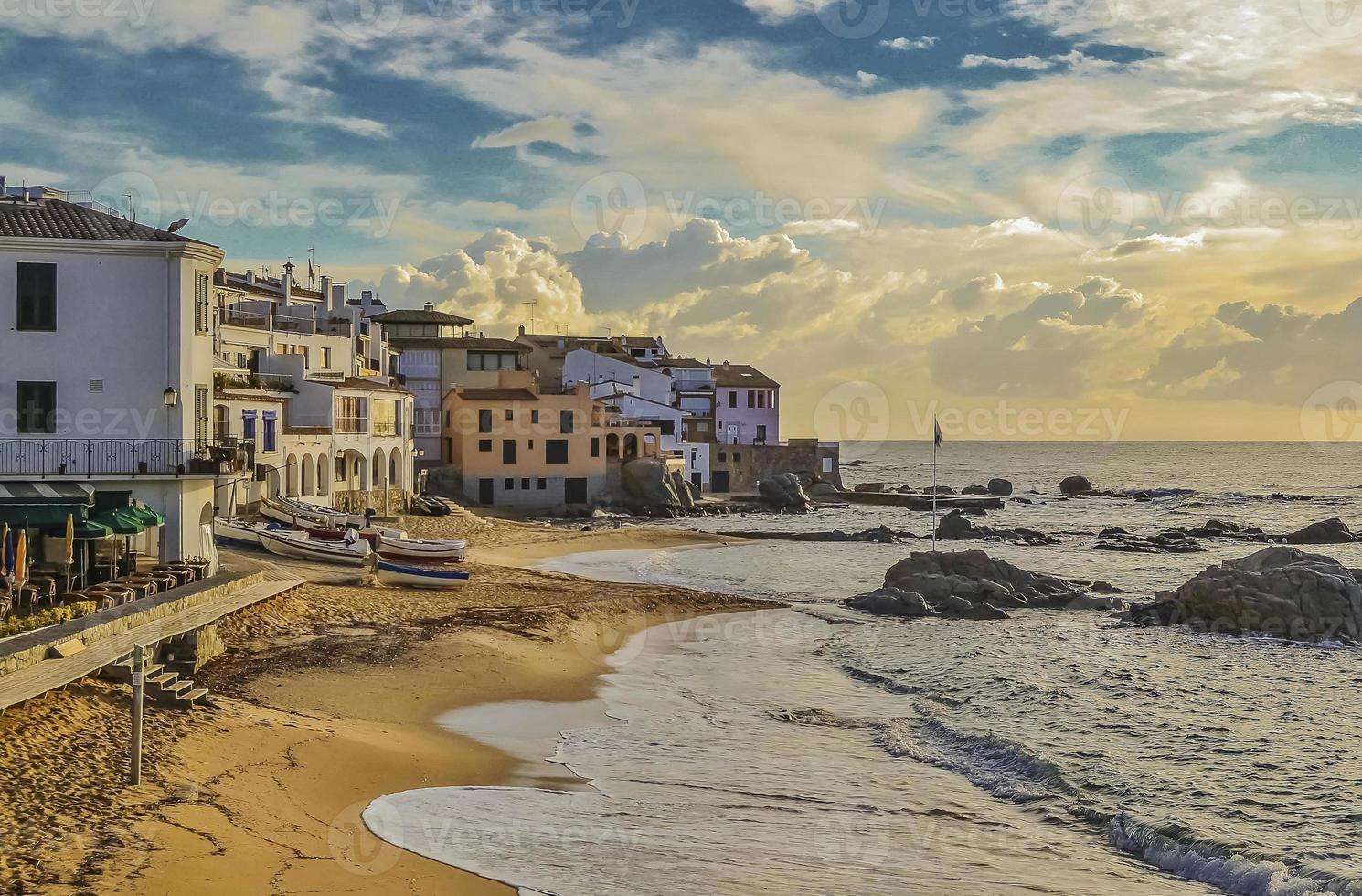 Seafront Calella town beach sunset photo