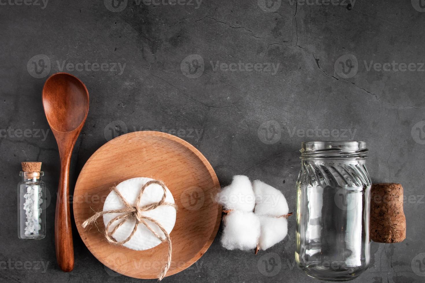 Set of recyclable accessories made of wood and glass on a concrete background photo