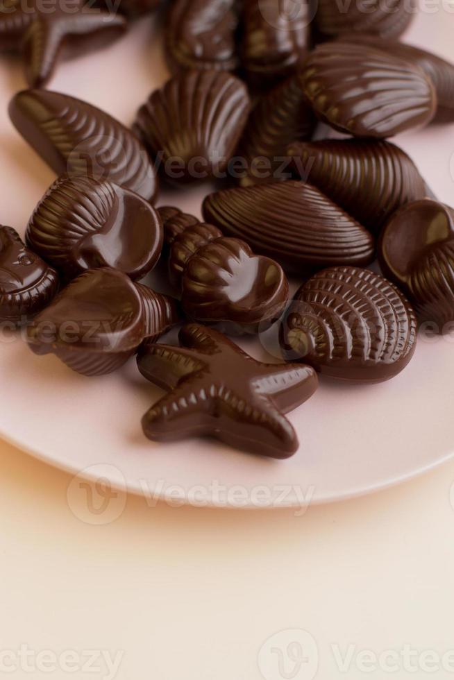 Caramelos de chocolate con forma de concha belga tradicional lugar para el texto foto