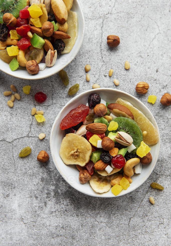 Bowls with various dried fruits and nuts photo