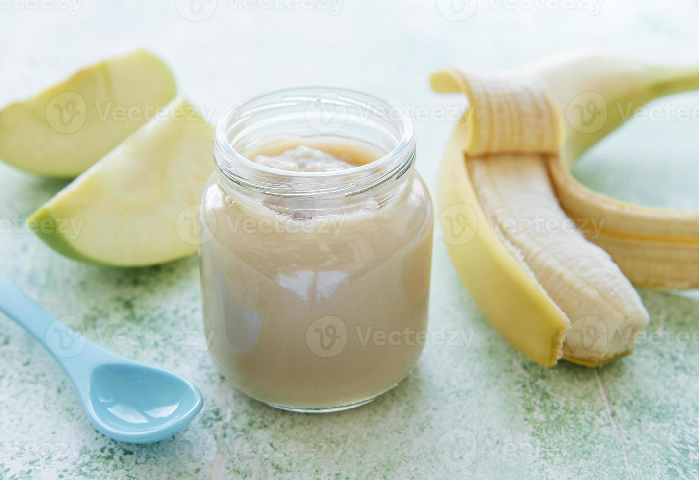 Jar of banana puree apples and banana photo