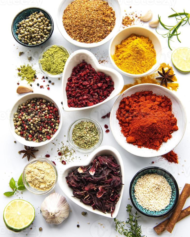 Various spices in a bowls  on white  background photo