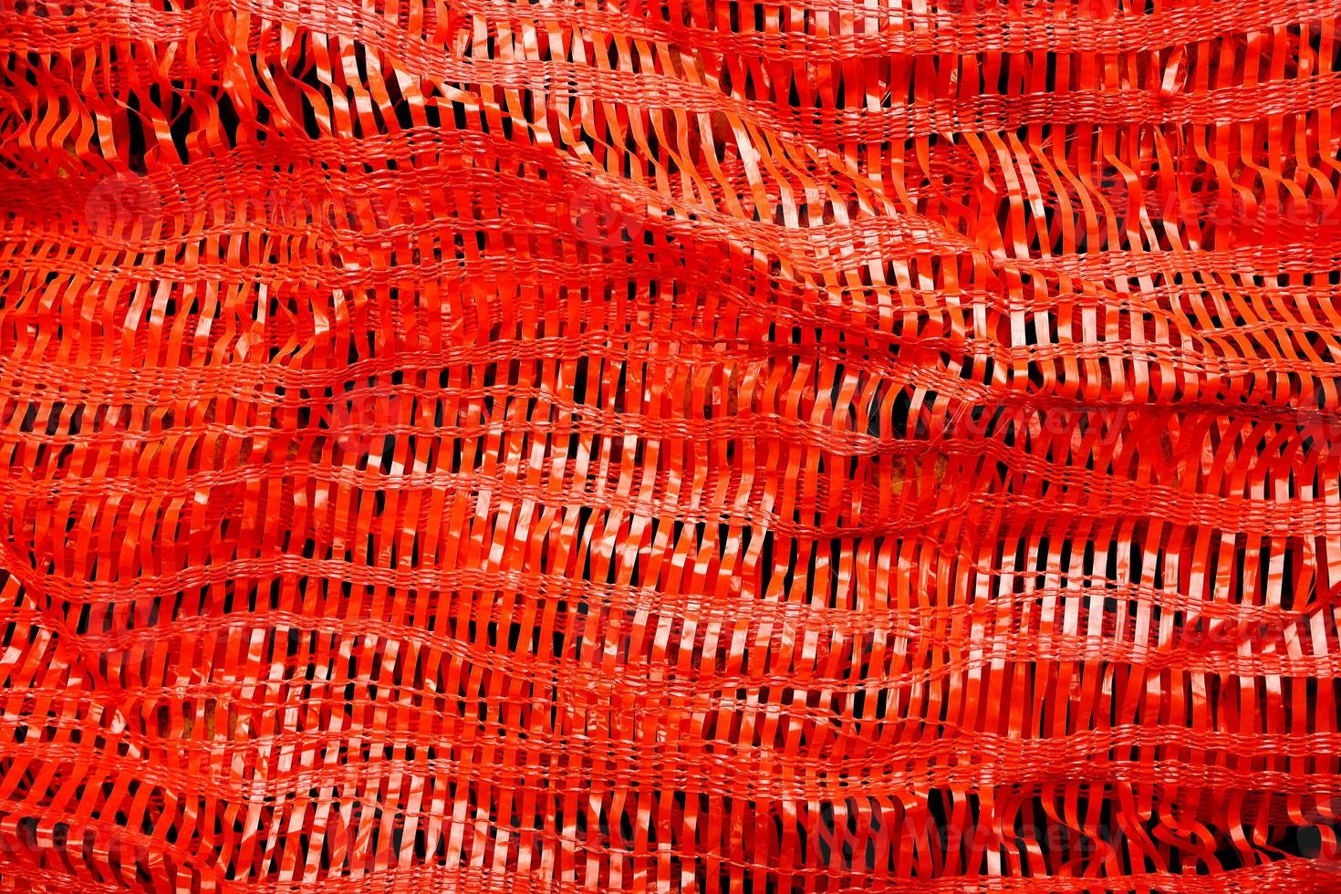 Red plastic woven background photo