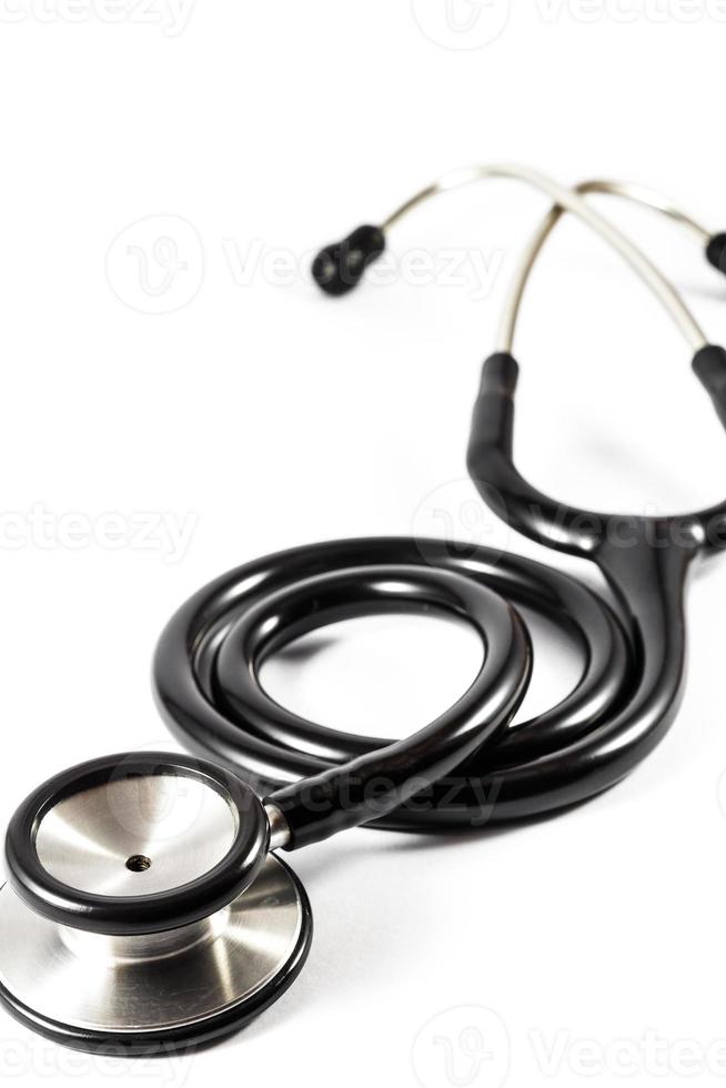 black stethoscope on white isolated background photo