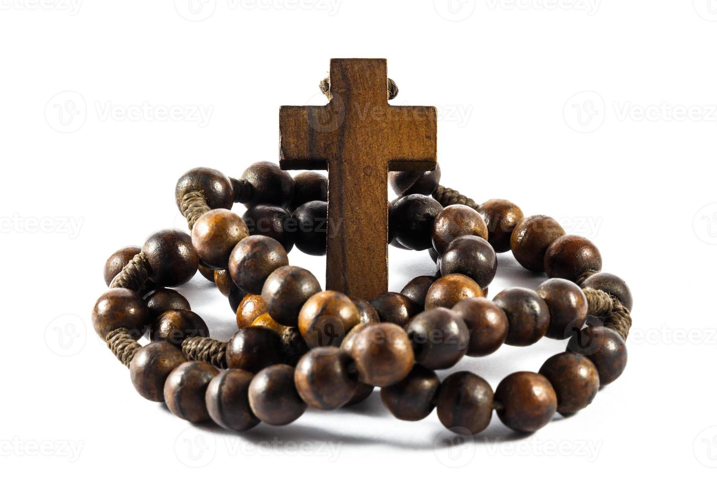 Wood rosary and cross with isolated background photo
