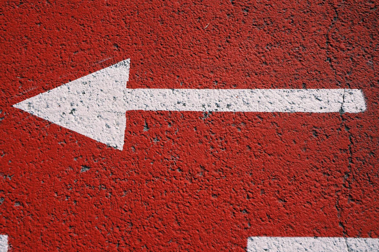 arrow road sign on the street photo