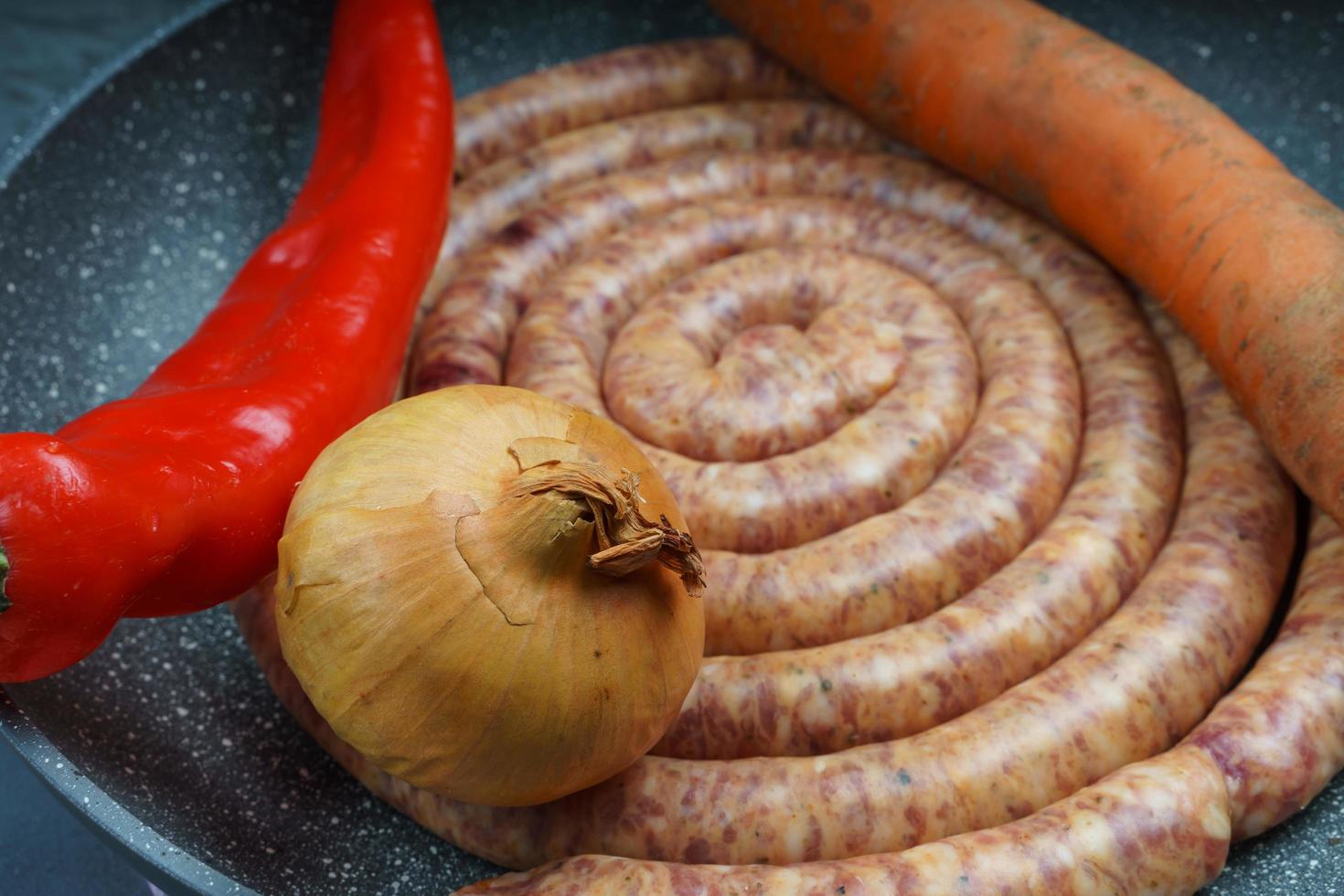 Raw pork saussage with ingredients photo