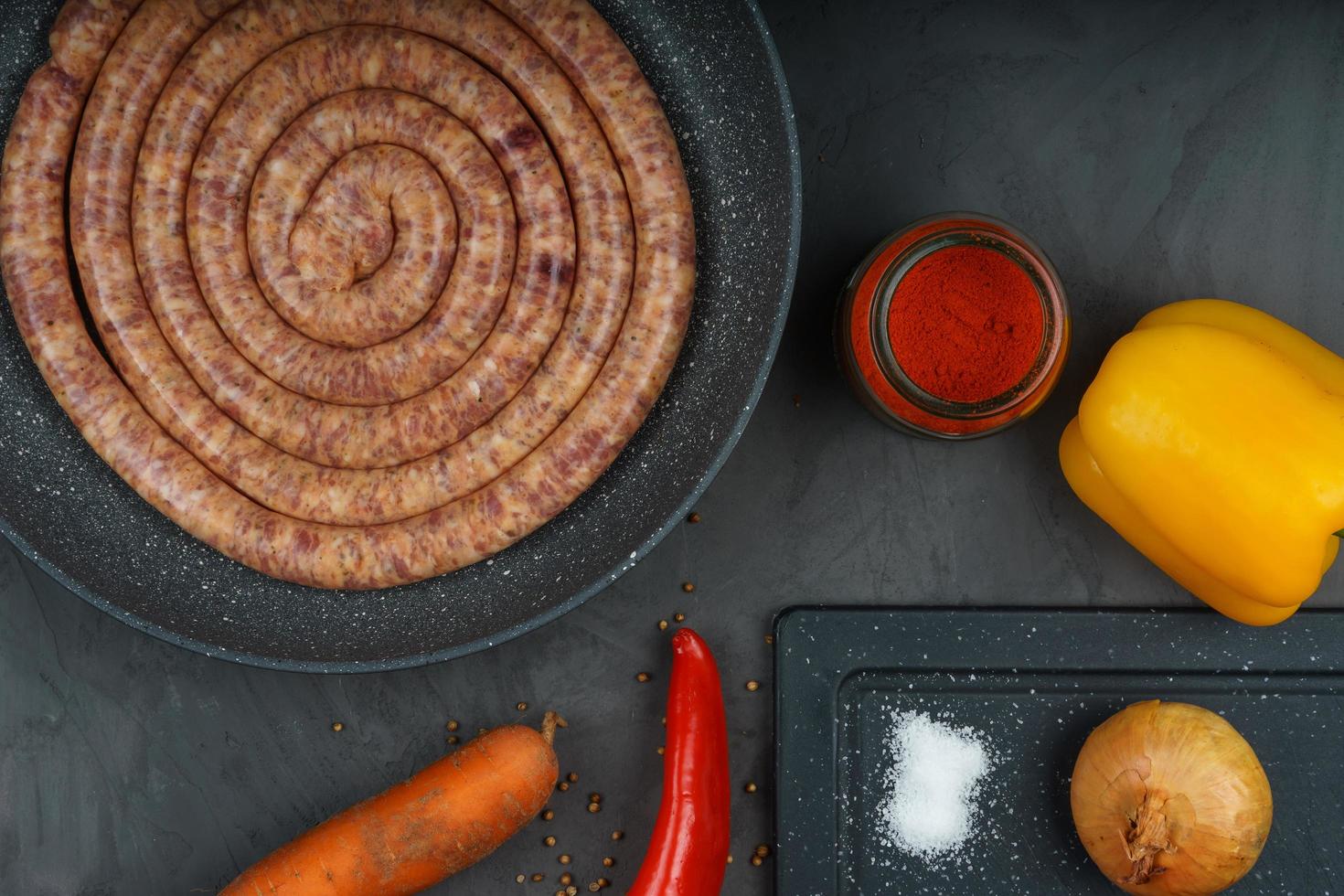 Raw pork saussage with ingredients photo