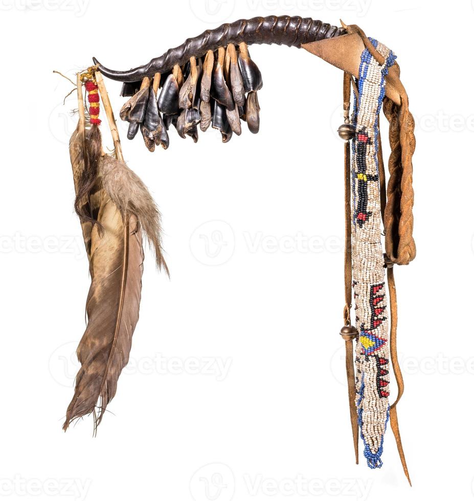 Dance rattle of the North American Indian horn with deer hooves and feathers photo