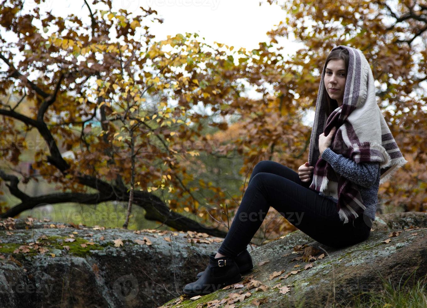 A cute beautiful modest girl with a scarf or scarf on her head photo