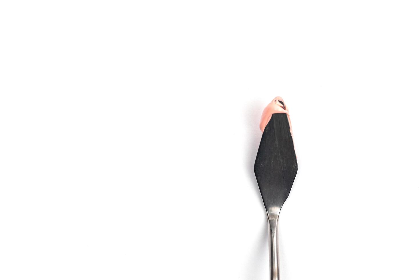A painting palette knife isolated on a white background photo