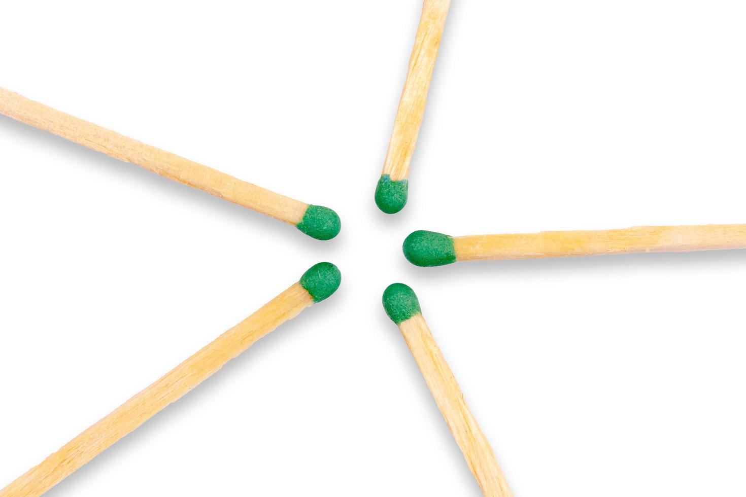 Wooden matches laid out in the shape of a star on white background photo